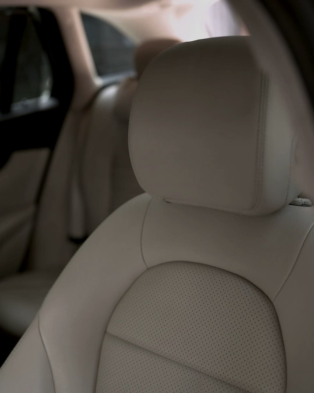 Beige perforated leather seat of a Mercedes-Benz GLC after a deep clean.